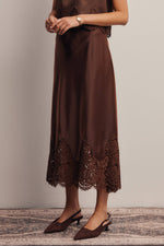 Listicle Stretch Satin Lace Trim Maxi Skirt Mocha soft sheen satin worn with pointed flats for evening