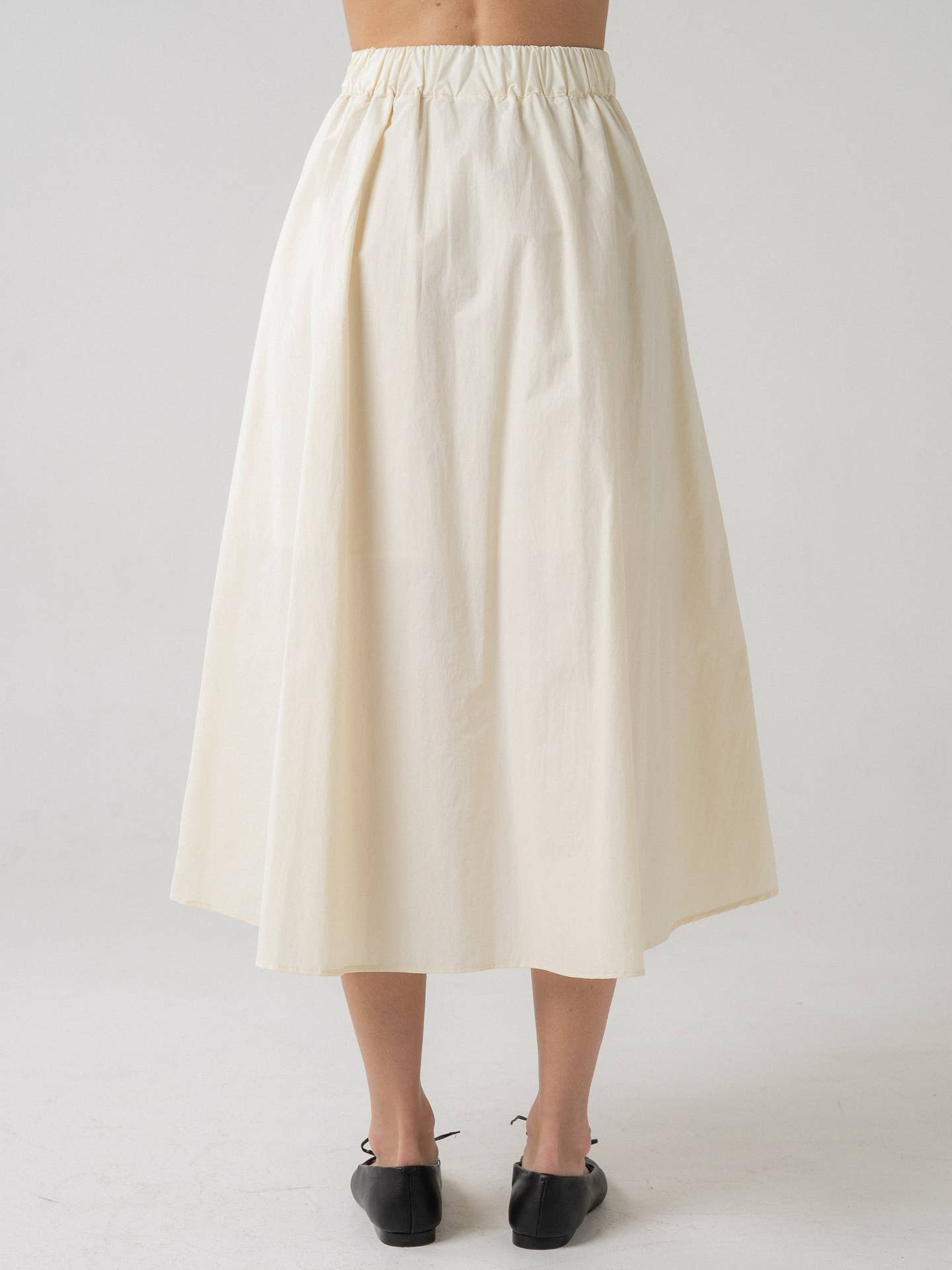 Cora Pleated Midi Skirt with Asymmetrical Hem
