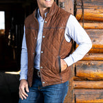 Madison Creek Outfitters Beaver Creek Waxed Goat Suede Leather Vest Bourbon snap front vest layered over a button down shirt for cowboy style in Park City