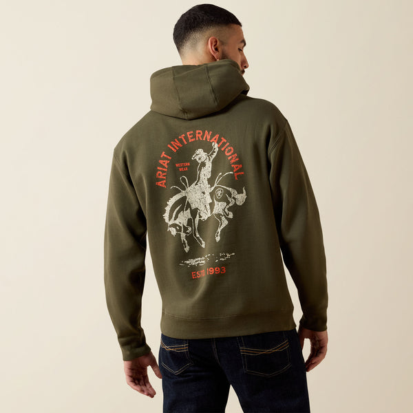 Ariat Mens International Rodeo Hoodie at boltranchstore.com in stock free shipping A man wearing an olive green pullover hoodie with a graphic print on the left chest