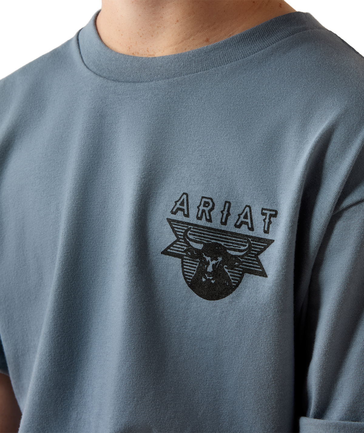 Ariat Boys Rope and Ride T Shirt Light Denim black Ariat bull skull screen print on the left chest with a ribbed crew neck cowboy style