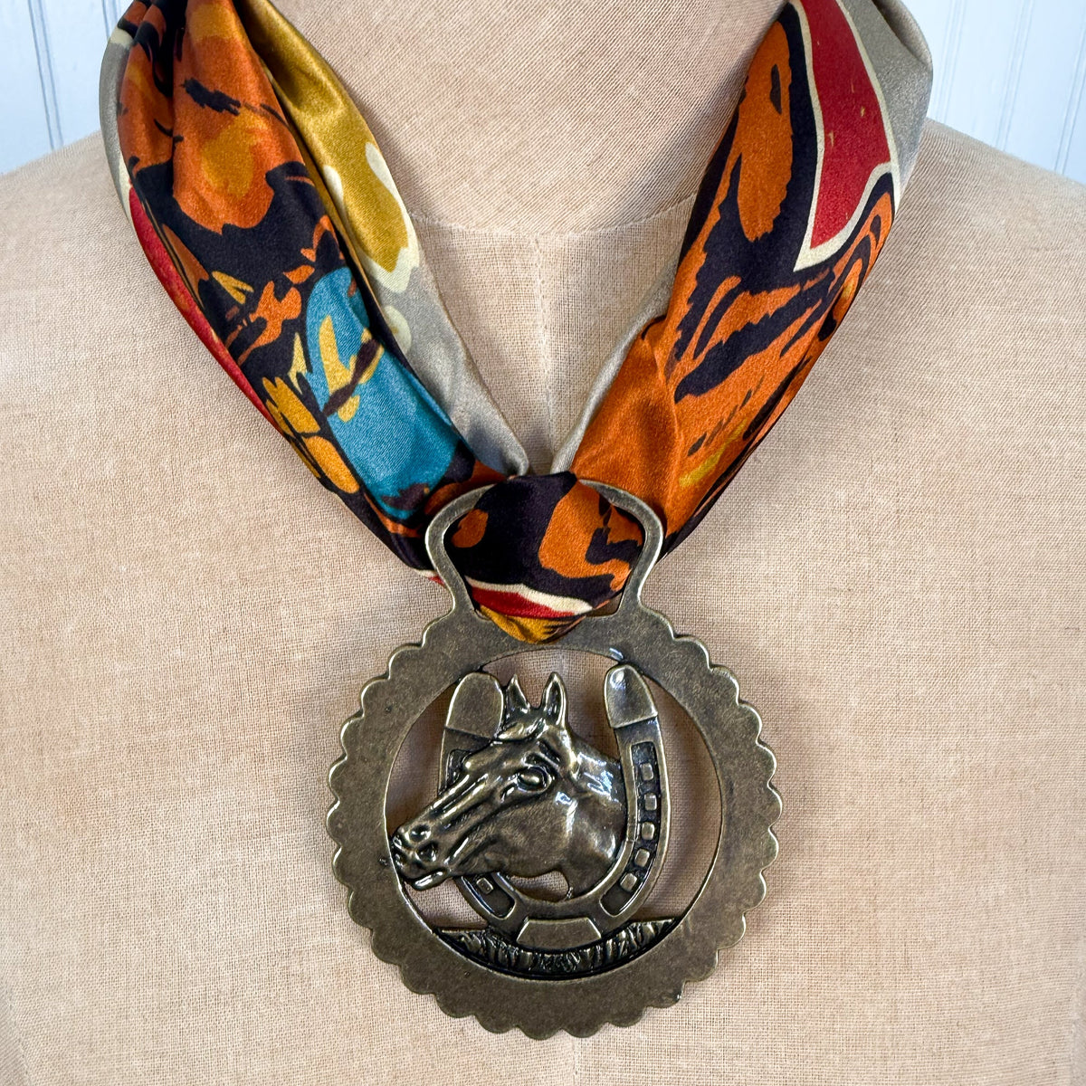 Fringe Slide Harnessed Lucky Horse horse brass style medallion with a horseshoe framed horse and split top opening womens western boutique Utah SKU SLDEHRNLH26117